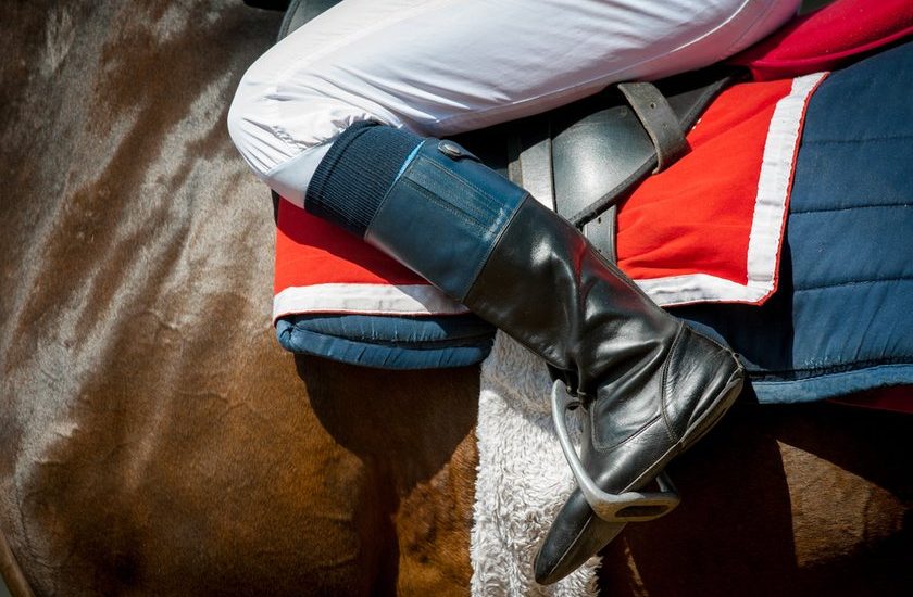 Leg of Jockey Sitting in Saddle