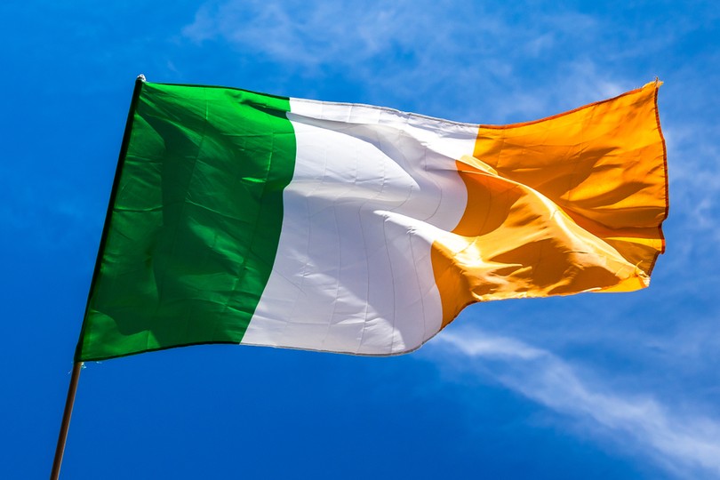 Ireland Flag Against Bright Blue Sky